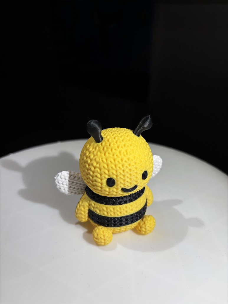 3D printed knitted-texture bee figurine